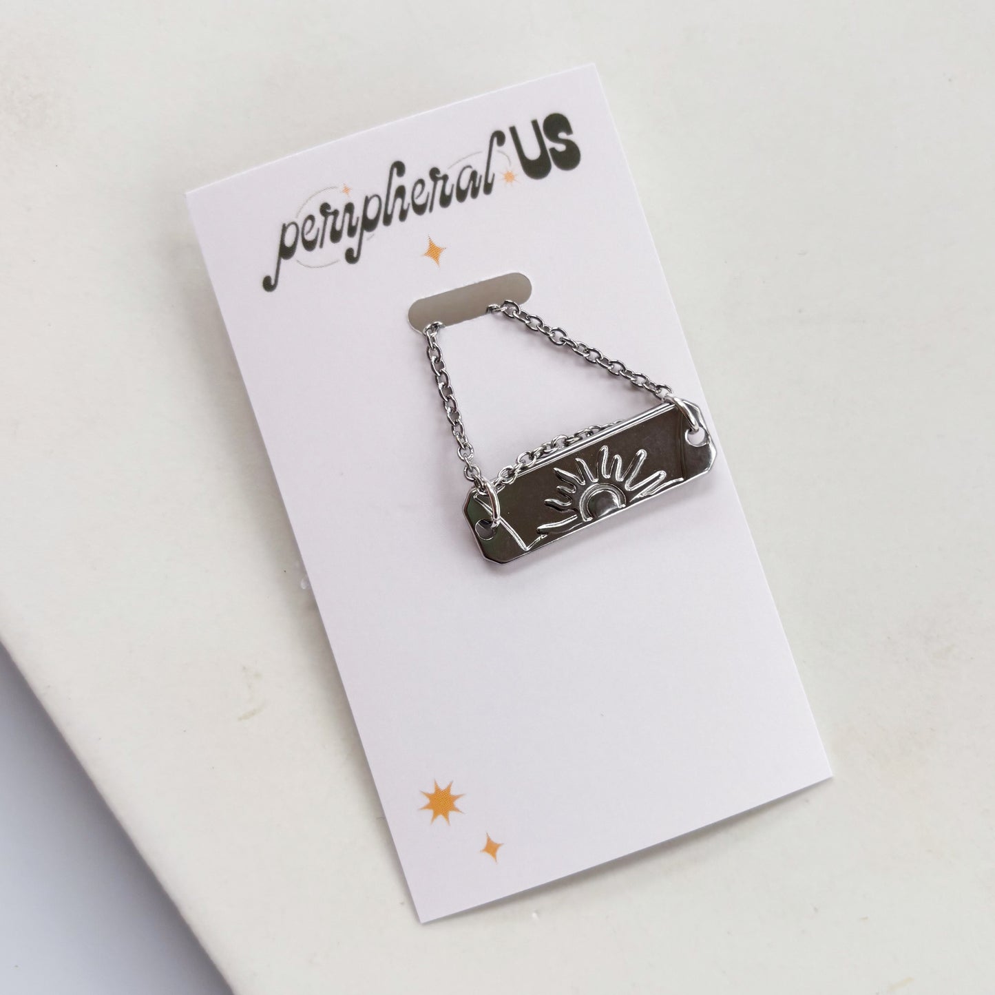 SILVER SUN CHARM NECKLACE