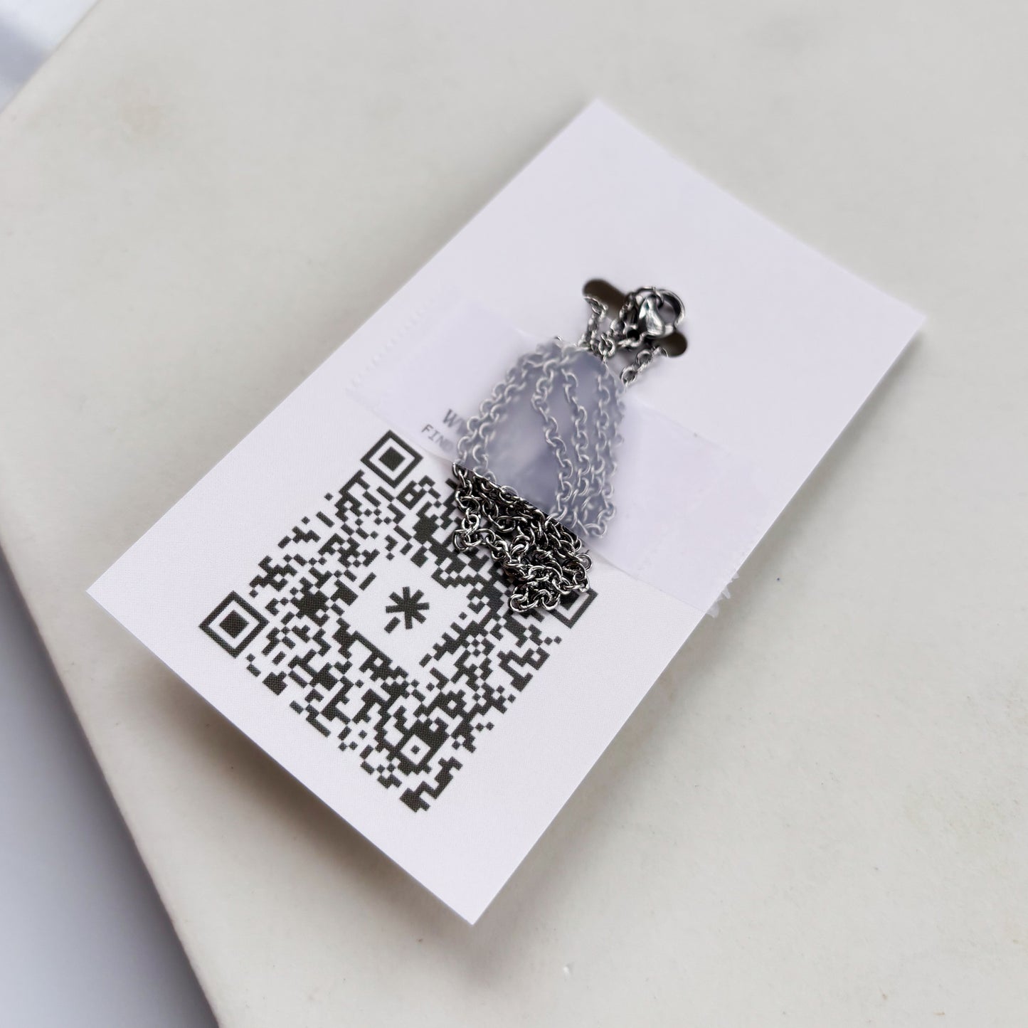 SILVER SUN CHARM NECKLACE