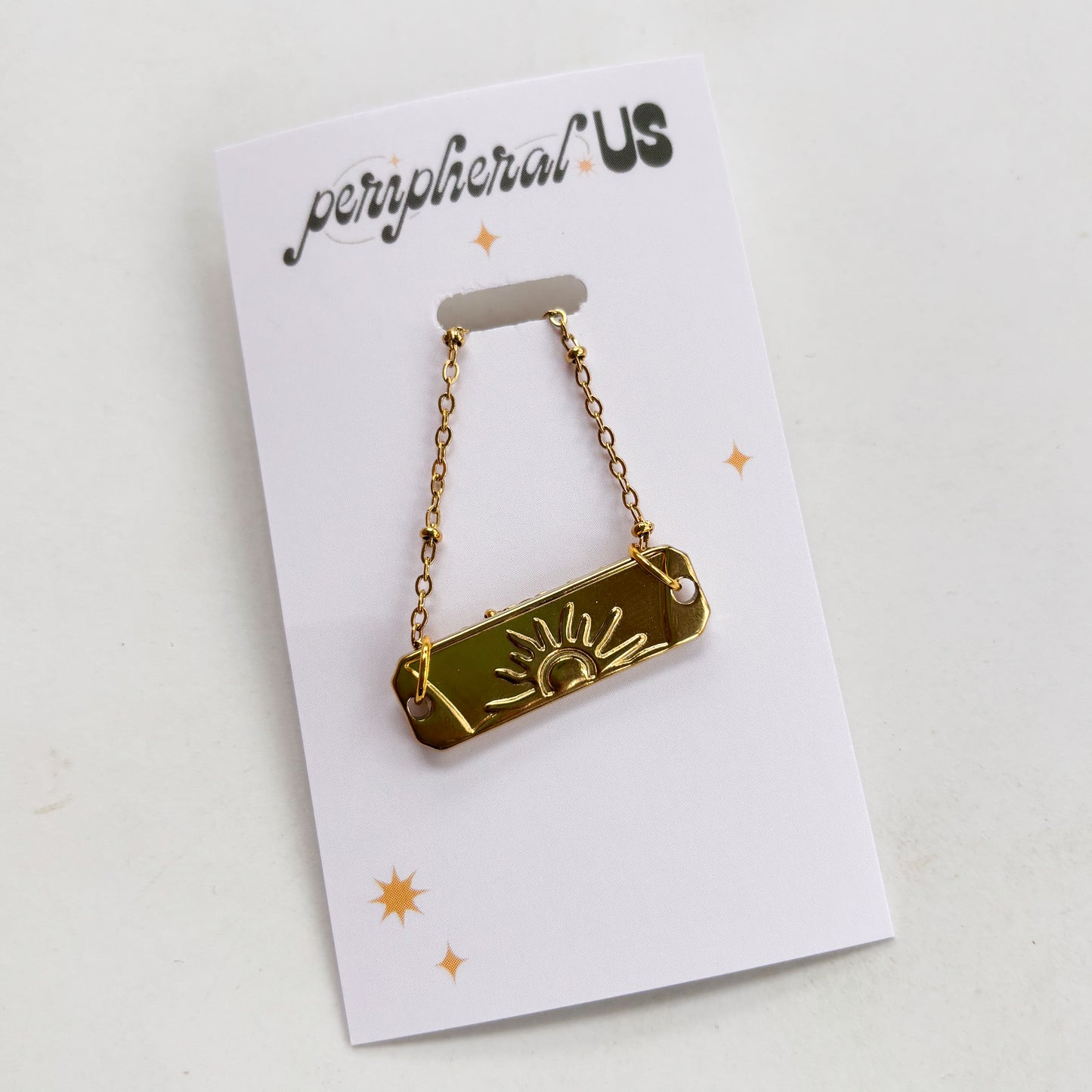 GOLD SUN CHARM NECKLACE