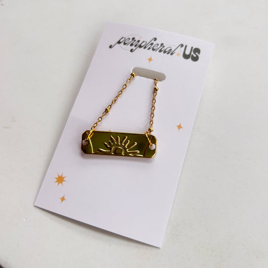 GOLD SUN CHARM NECKLACE