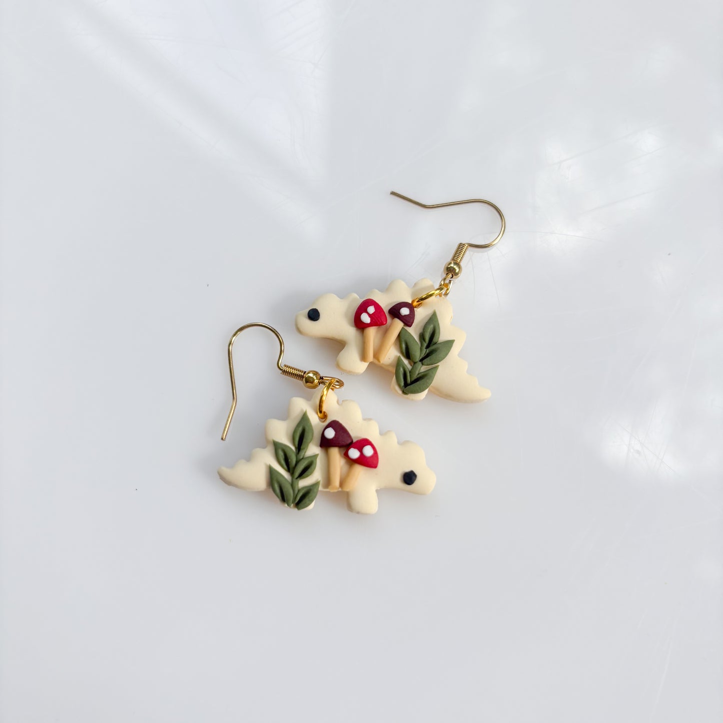 IVORY MUSHROOM DINO EARRINGS (STEGO)