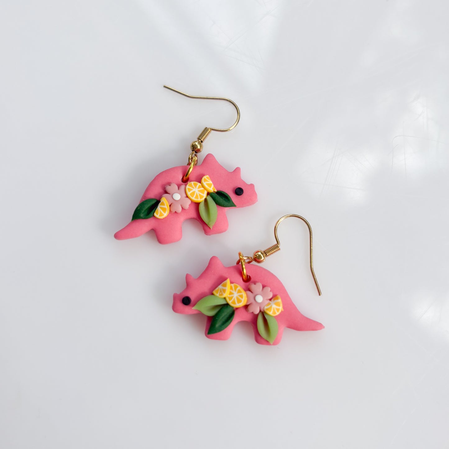 PINK LEMONADE DINO EARRINGS (TRICERATOPS)
