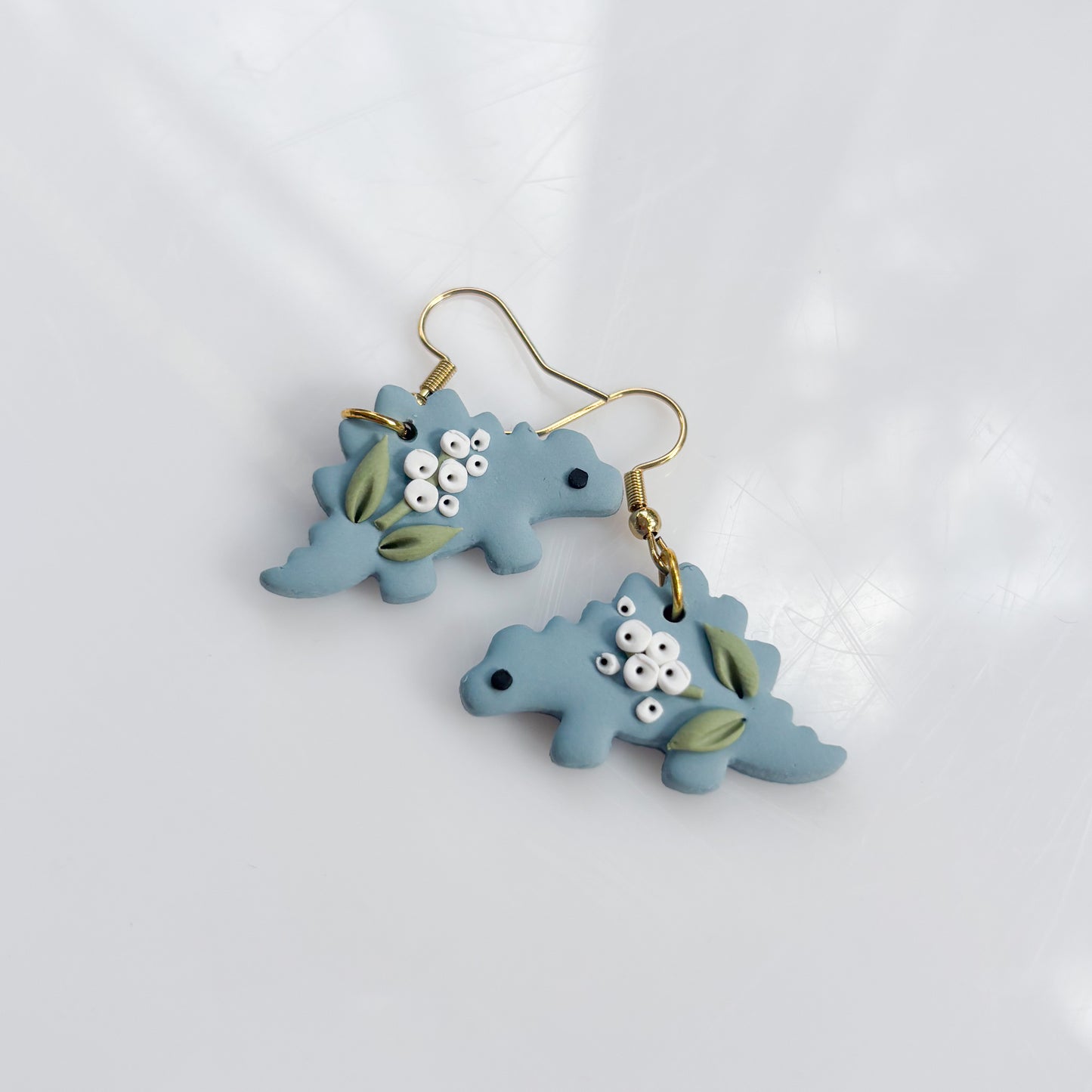 BLUE BABYS BREATH DINO EARRINGS (STEGO)