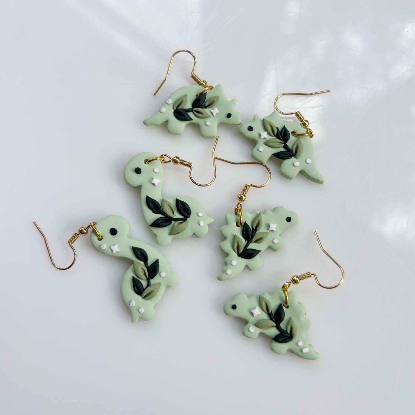 GREEN VINE DINO EARRINGS (STEGO)