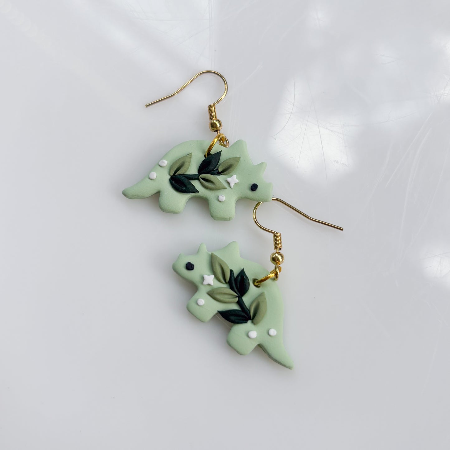 GREEN VINE DINO EARRINGS (TRICERATOPS)