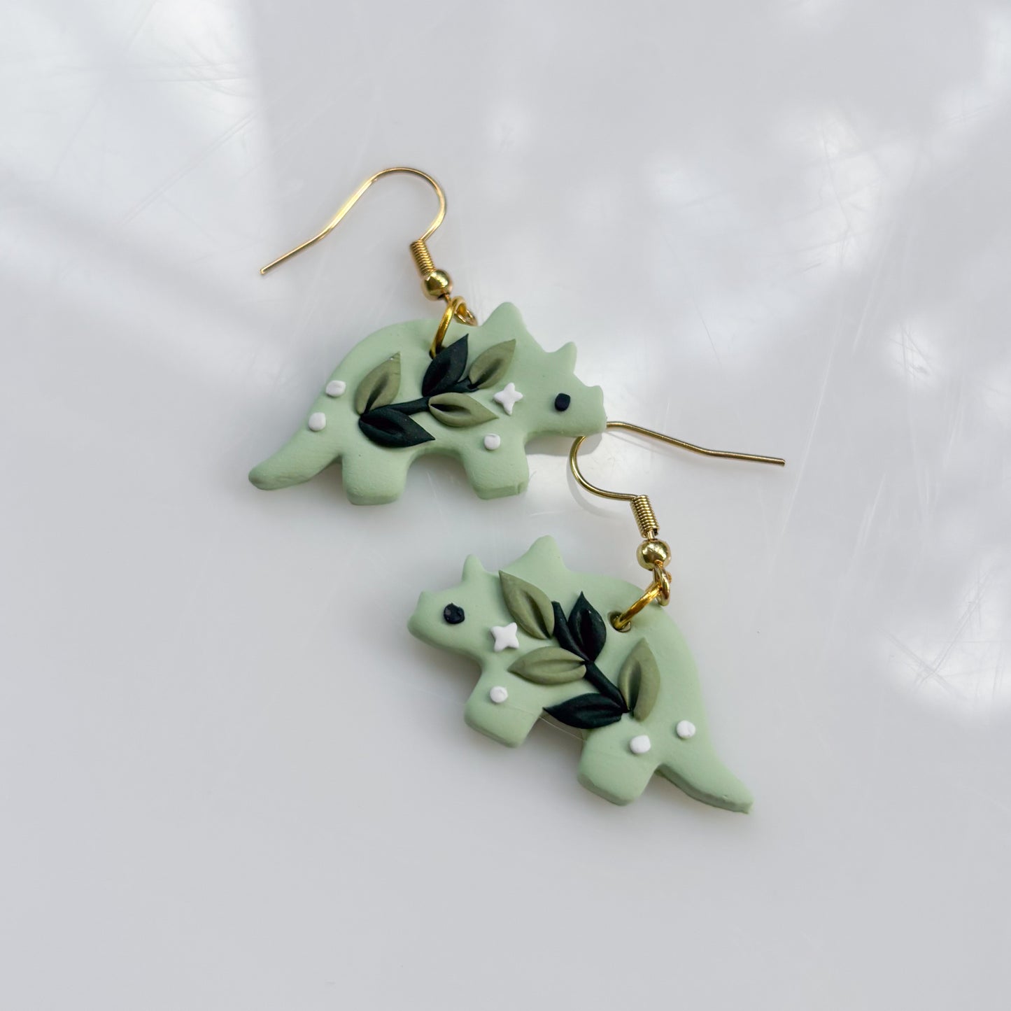 GREEN VINE DINO EARRINGS (TRICERATOPS)