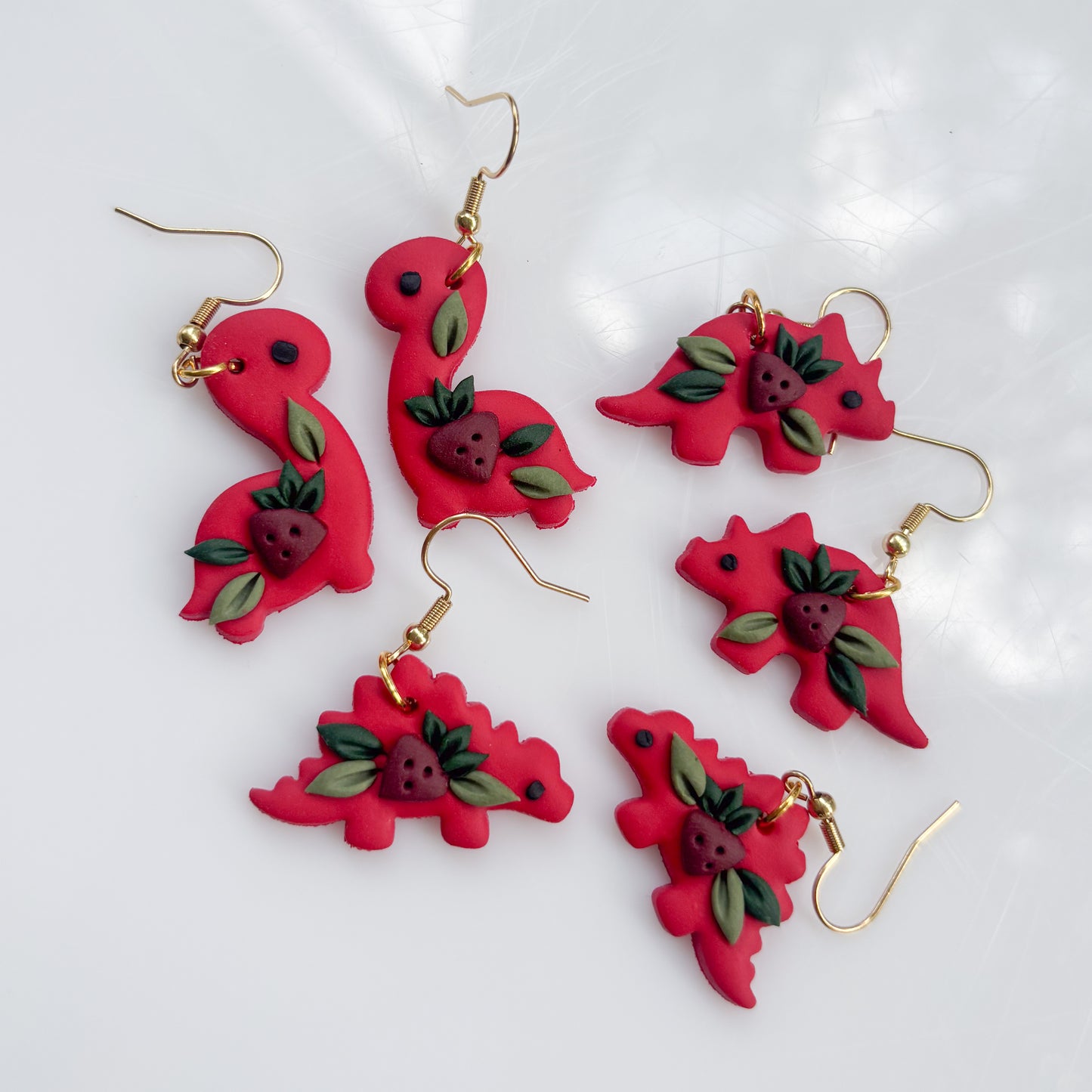RED STRAWBERRY DINO EARRINGS (TRICERATOPS)