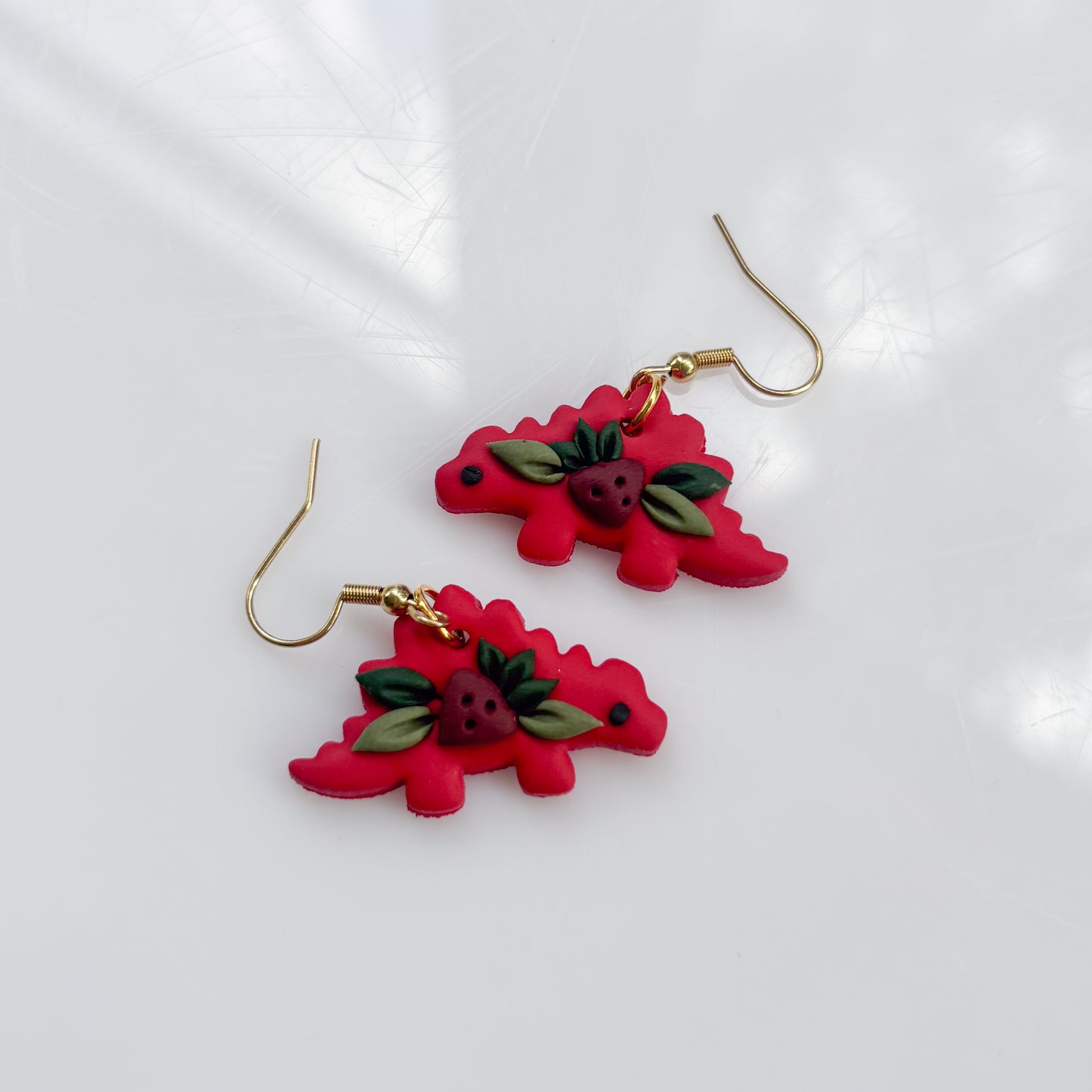 RED STRAWBERRY DINO EARRINGS (STEGO)