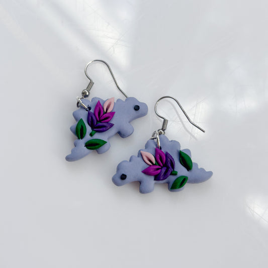 LAVENDER DINO EARRINGS (STEGO)