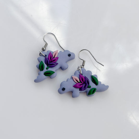 LAVENDER DINO EARRINGS (STEGO)