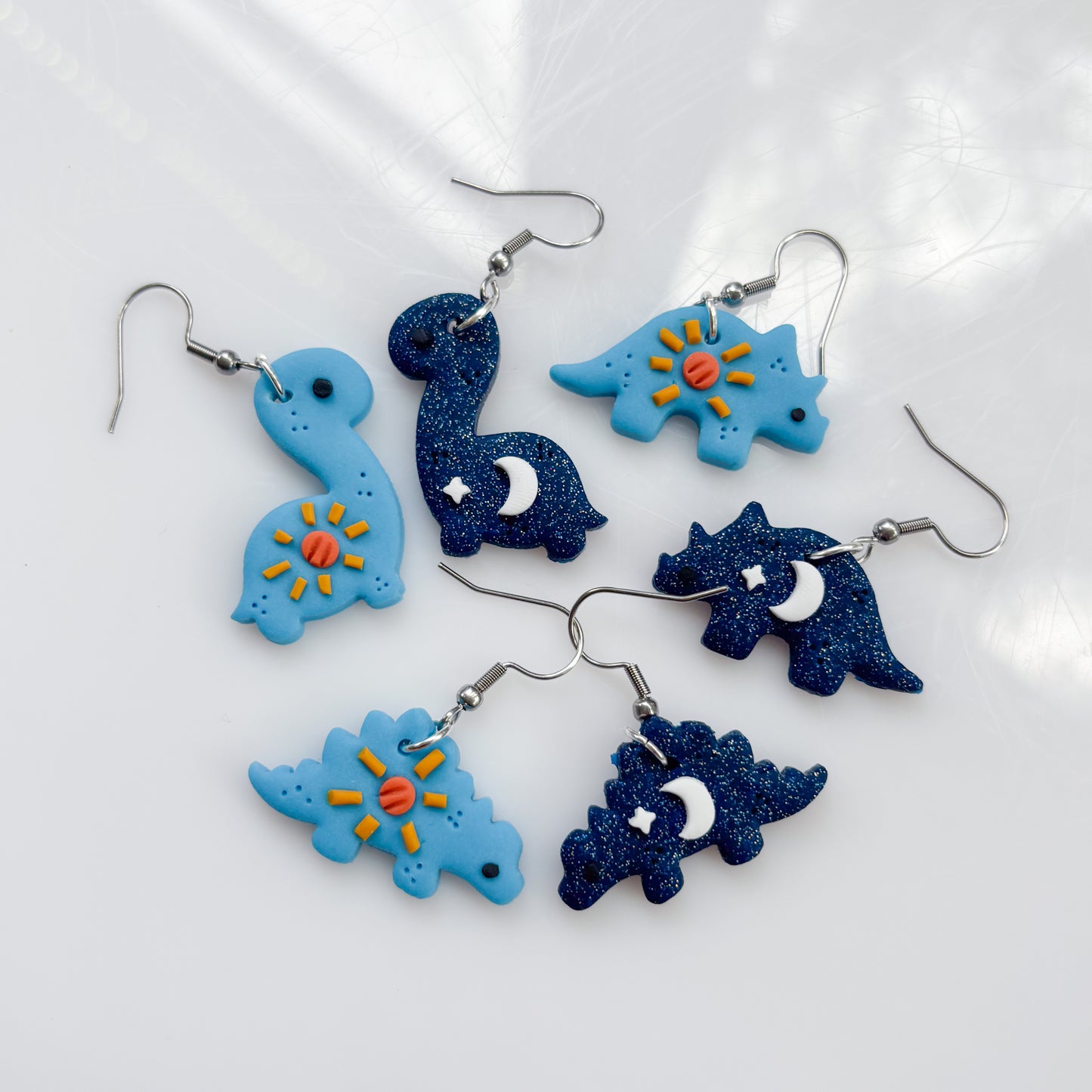 SUN & MOON DINO EARRINGS (TRICERATOPS)