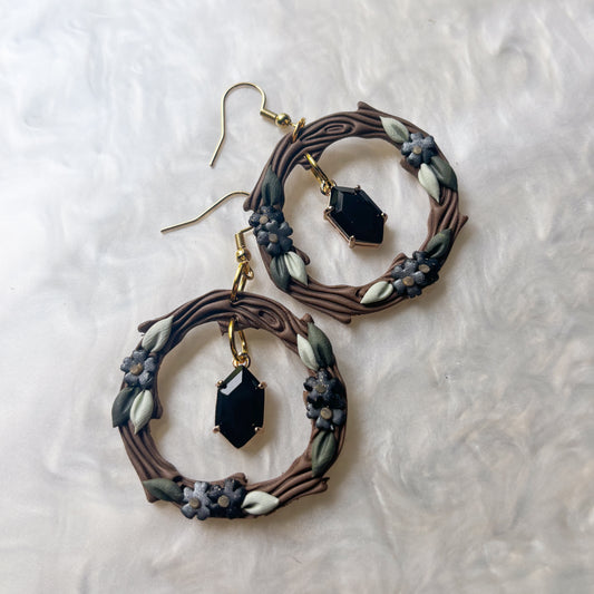 WOODLAND BLACK FLOWER CIRCLE EARRINGS