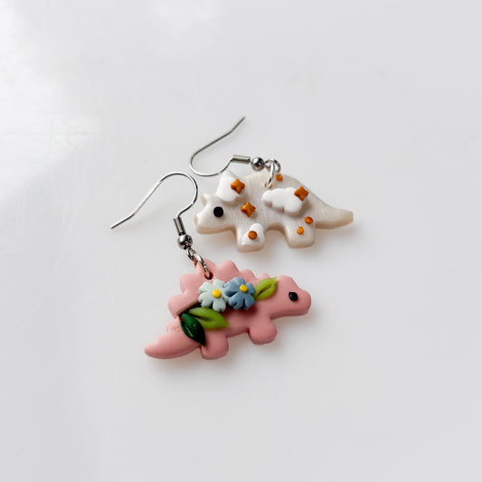 PINK STEGOSAURUS & PEARLY TRICERATOPS MISMATCHED EARRINGS