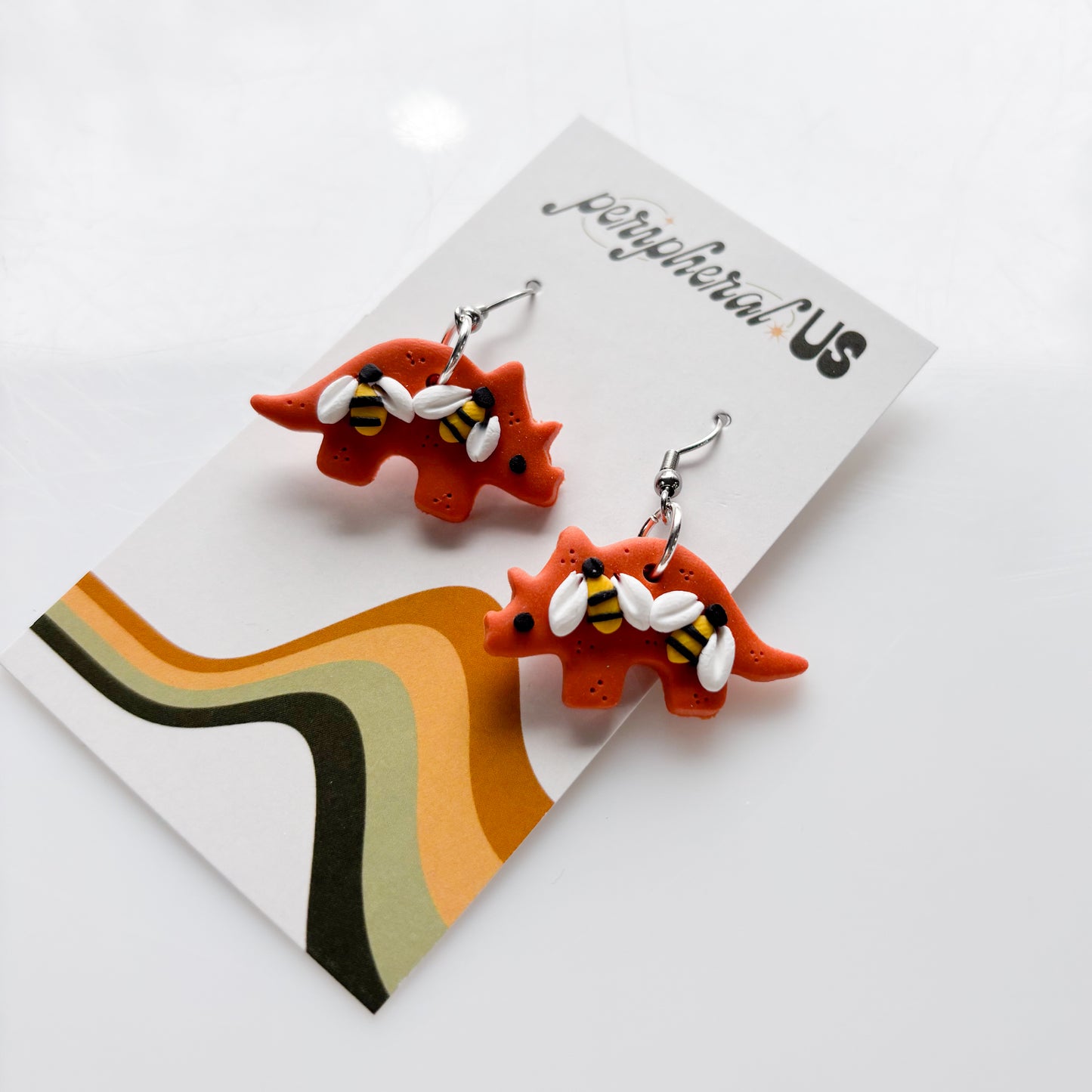 ORANGE BEE TRICERATOPS EARRINGS