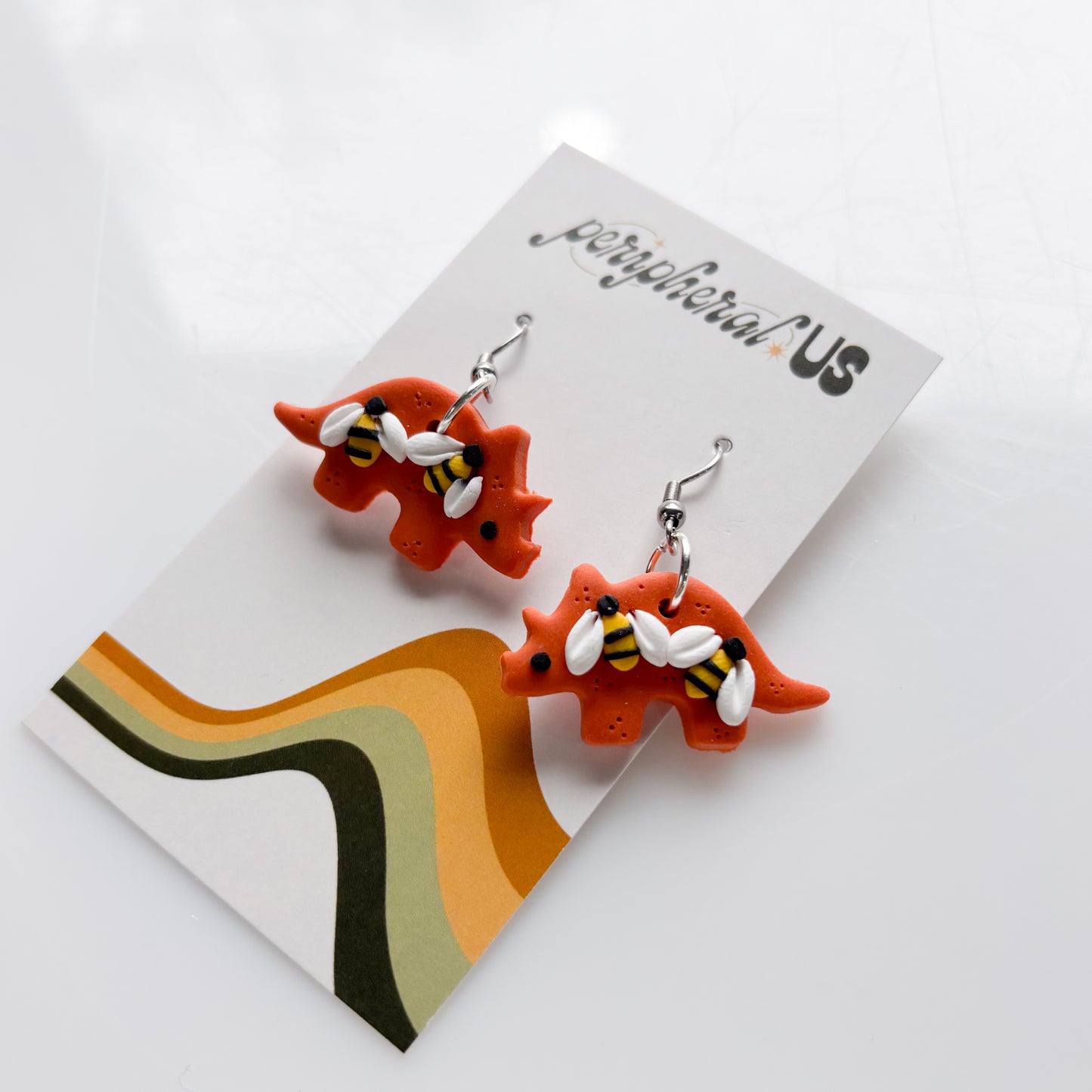 ORANGE BEE TRICERATOPS EARRINGS