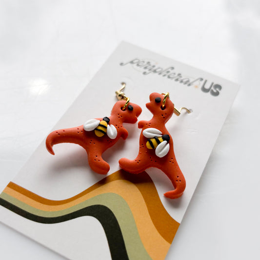 ORANGE BEE T-REX DINO EARRINGS