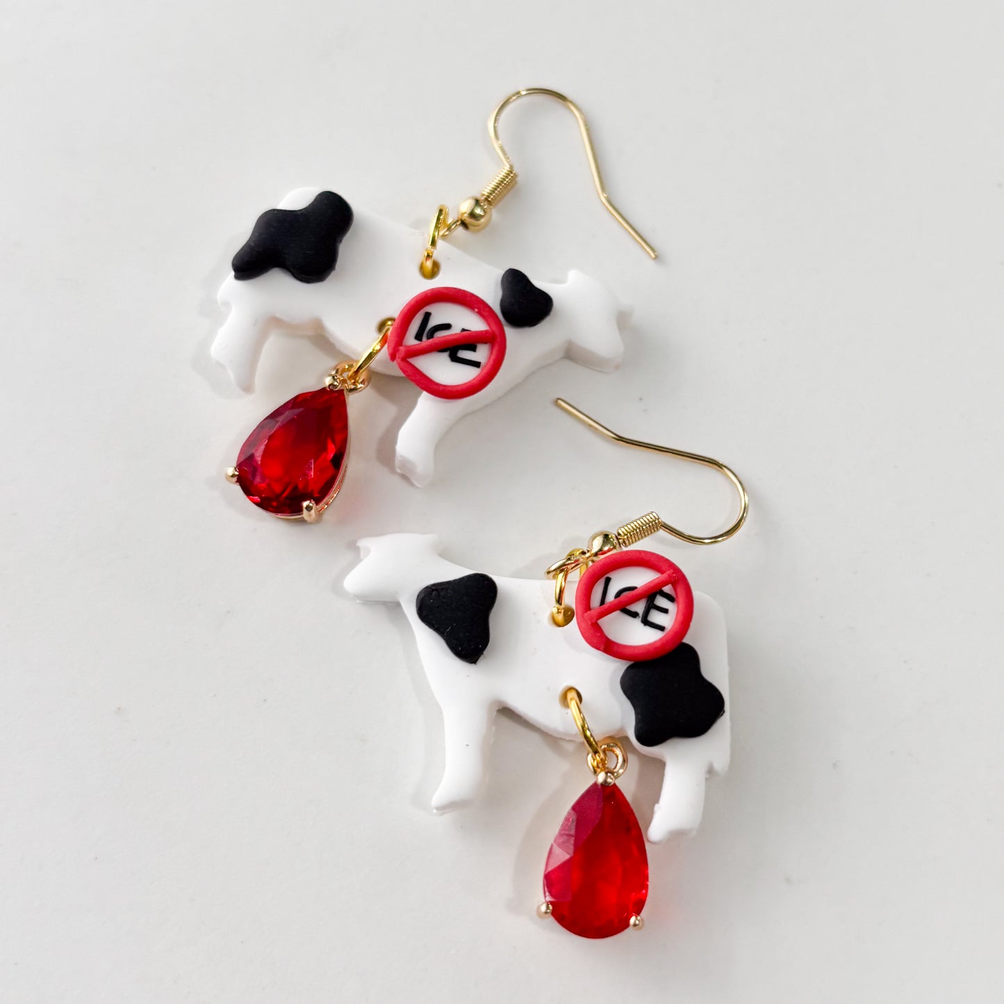 ICE OUT COW EARRINGS
