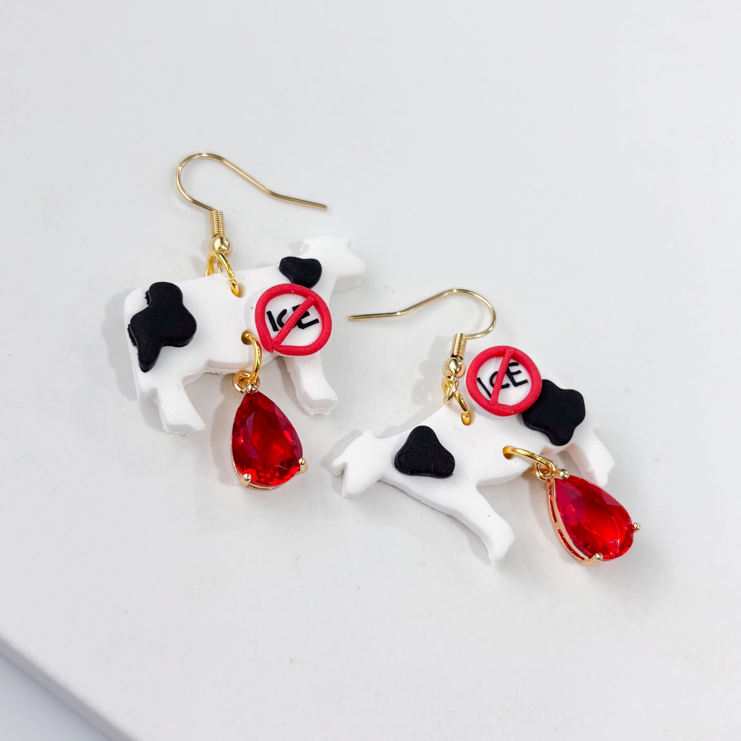 ICE OUT COW EARRINGS