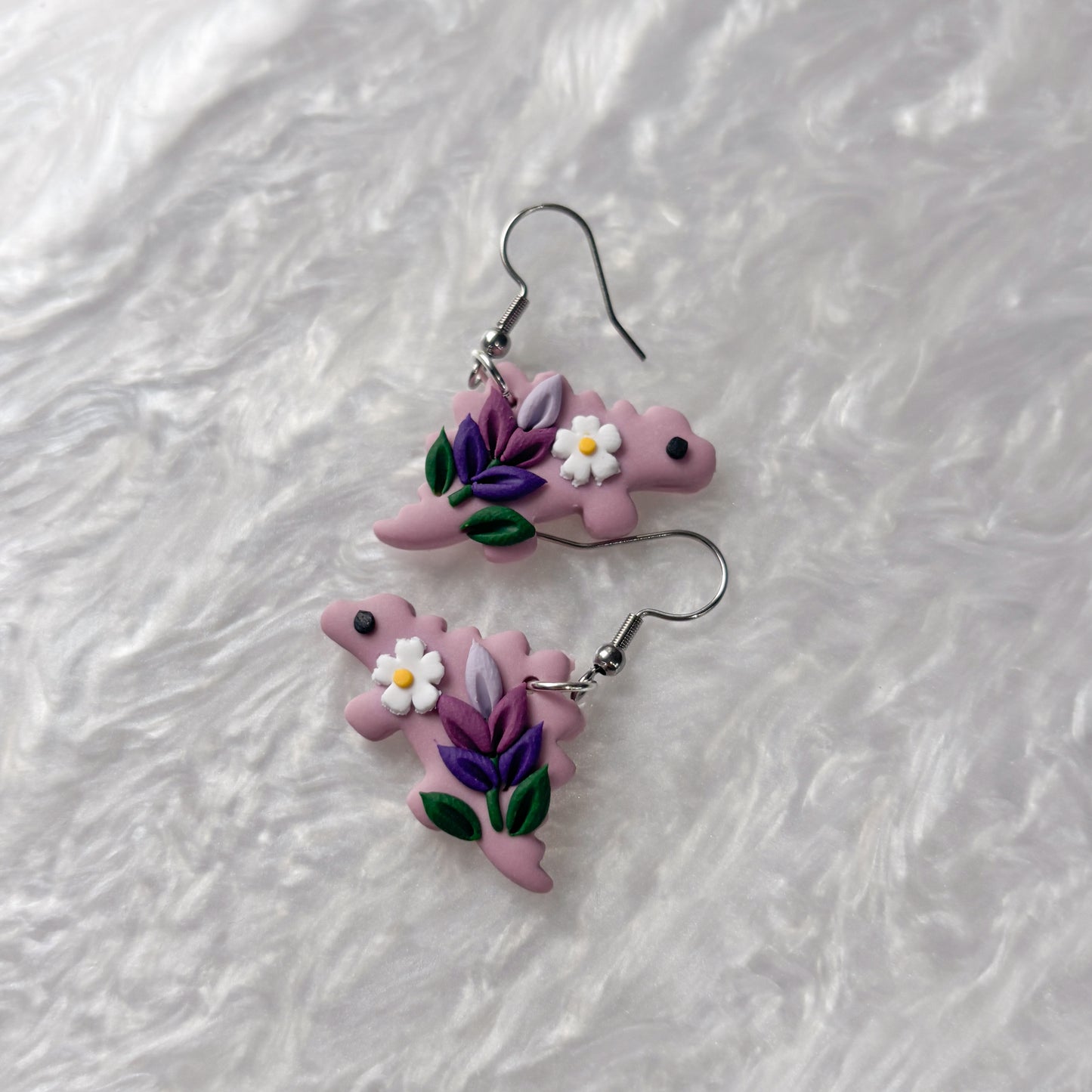 LAVENDER DINO EARRINGS (STEGOSAURUS)